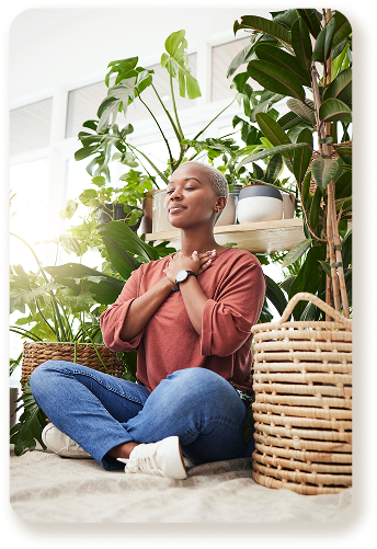 wellness-peace-woman-breathing-by-plants-meditation-natural-greenhouse-breathe-gratitude-young-calm-african-female-person-with-relaxing-zen-mindset-by-indoor-nursery-garden 1
