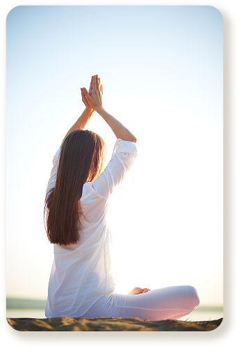 woman-practicing-yoga-seashore 1